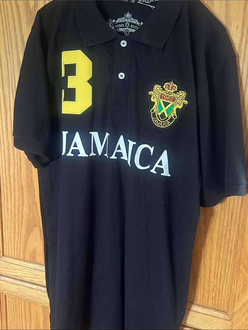 Robin Ruth Black Polo with Yellow Number and Jamaica Crest